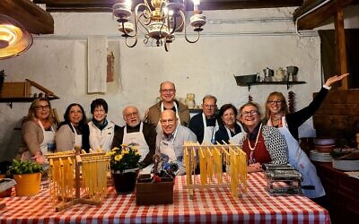 A DnS tour group living the good life with wine, pasta, history, and fellowship.
