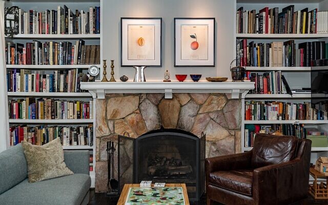 Original photography by Dan Winters of citrus fruits sits above Koplan’s fireplace.