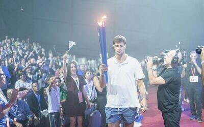 Deni Avdija, of the Washington Wizards, had the honor of spearheading the torch lighting procession during the opening ceremony of the 41st JCC Maccabi Games // Photo Credit: JCC Association 