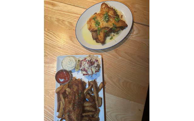 Two other well received seafood entrees were the parmesan crusted trout piccata (top) and a hearty portion of blue cod fish and chips.