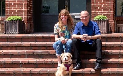 Laura Adams and Andrew Feiler relax with rescue pup Vera on the steps of their historic renovation of the B. Mifflin Hood Brick Company into their home and art studio // Photos by Howard Mendel
