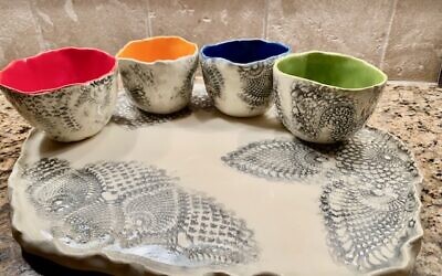 Kraus uses crochet for texturing and bright colors for contrast seen in this set for dips or tea.