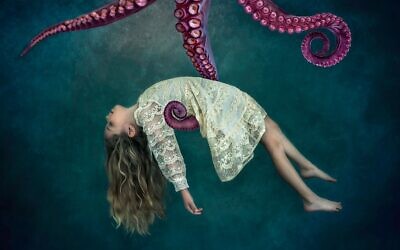 Kauffman photographed her daughter and composited her into an underwater ocean scene.