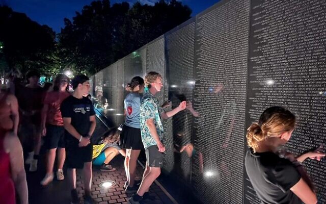 Etgar 36 teens visited the Vietnam Veterans Memorial in Washington, D.C., at night.