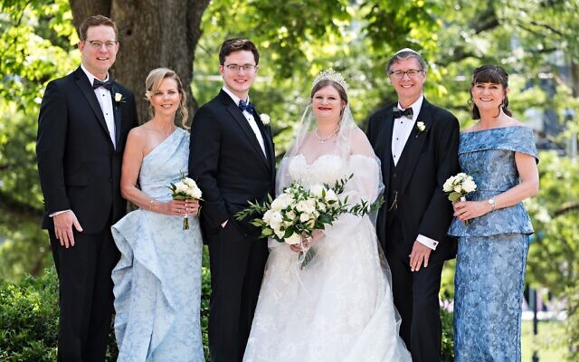 (From left) Parents Timothy Graubert and Becky Parks, and Michael Morris and Belinda Morris flank the bride.