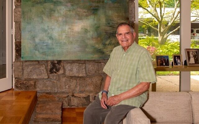 Richard Franco sits in front of his favorite “Phyllis painting” where he could find peace looking at the river.