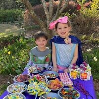 Noa and Aiden Binstock at the candy table for Dunwoody Minyan’s first Purim Seudah.
