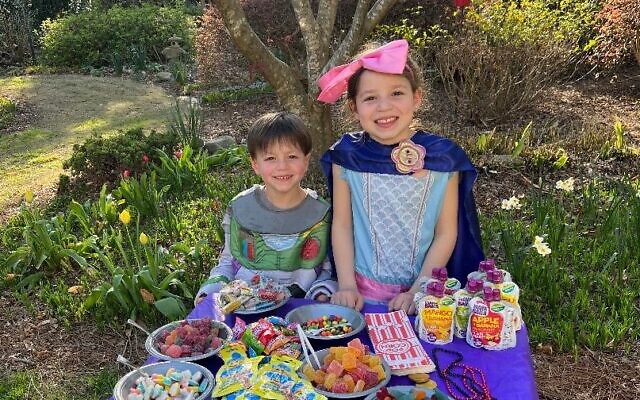 Noa and Aiden Binstock at the candy table for Dunwoody Minyan’s first Purim Seudah.