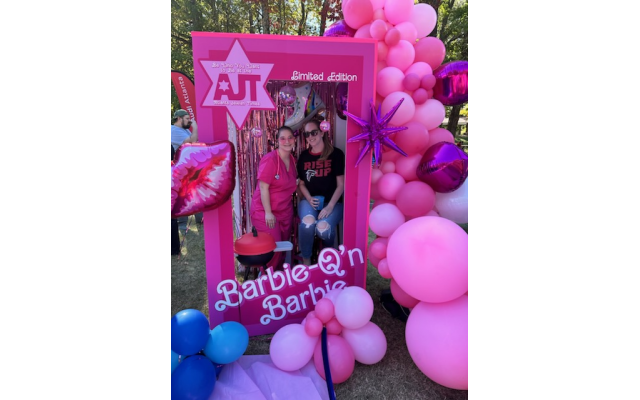 Creative director Lilli Jennison poses in the AJT Barbie box with sister, Micah Staley.