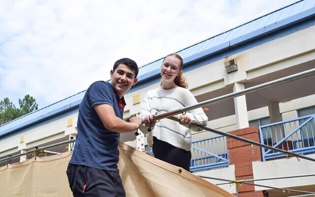 AJA students and faculty were hard at work last week constructing the sukkah.