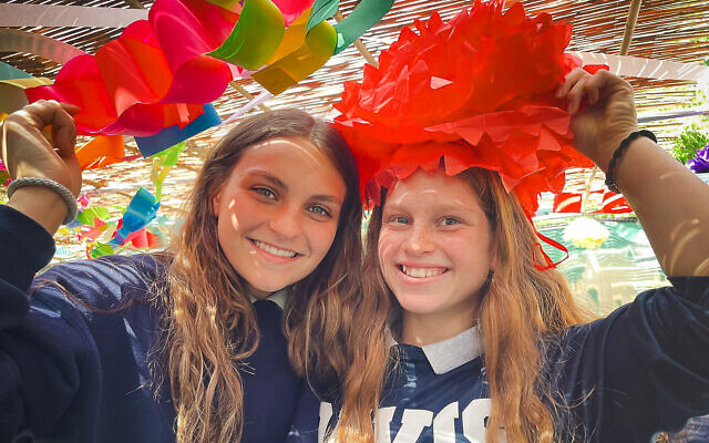 A pair of Davis students celebrate Sukkot.