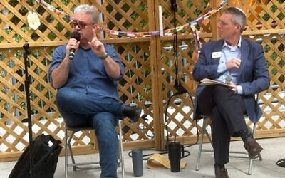 Temple Sinai Rabbi Ron Segal (right) led the discussion with Israeli Amit Mayer on Oct. 6.