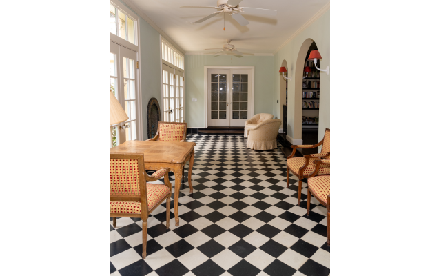 The black and white tile in the solarium is part of the original house. 