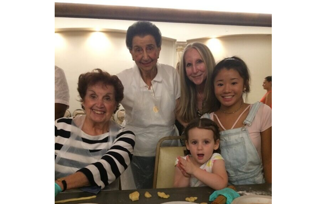 Renee, cousin, Julia Soriano, daughter, Olga Rickoff, and “grands” get their hands in the dough.