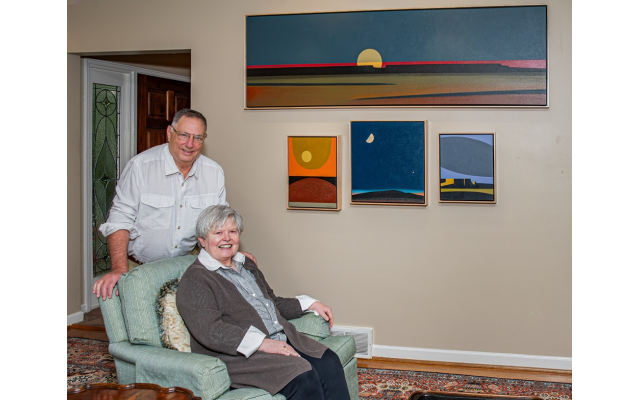 Above: Henry and Mary Carole relax in front of Navajo artist Daniel Namingha’s Western landscapes noted for their depiction of wide-open spaces with buttes and moons.