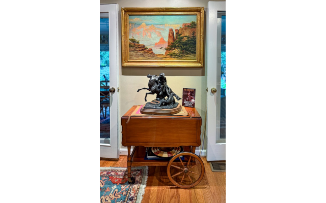 In the dining room is a restored 100-plus-year-original: ld painting of the Grand Canyon by Louis Benton Akin. Below is Ed Dwight’s “The Rescue,” a depiction of African American Buffalo Soldiers.