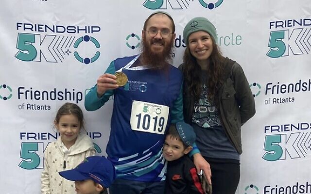 Co-directors Rabbi Shlomo and Chanky Freedman with family at the race.