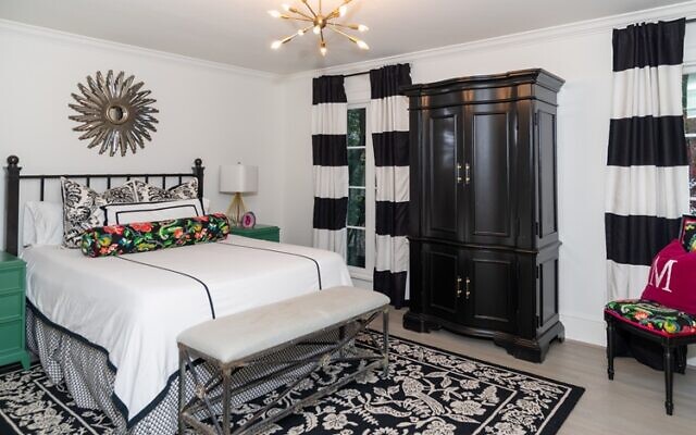 Robyn designed the guest room in black and white with colorful accents.