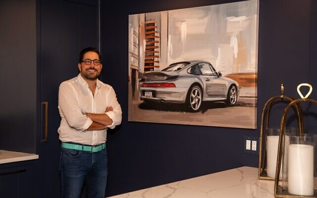 Tony stands by an original oil that Robyn commissioned for Father’s Day of his favorite Porsche 993 Turbo.