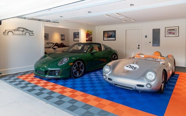The Marzullo garage has University of Florida colors: orange and blue for flooring. Some very impressive cars rotate in and out at Tony’s whim.