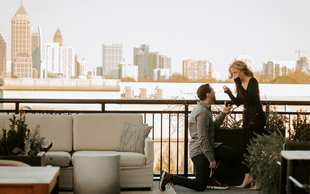 David surprised Paige with a formal engagement in front of the Atlanta skyline.