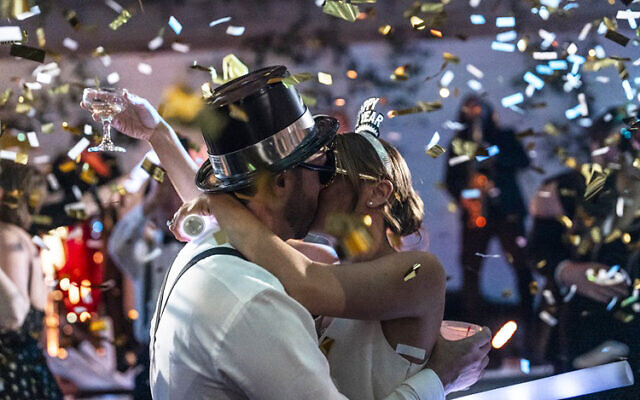Paige and David rang in 2024 as a married couple // Photos by Bryce France