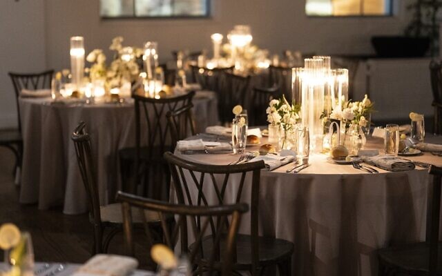 The tables were set among the candles and white tones.