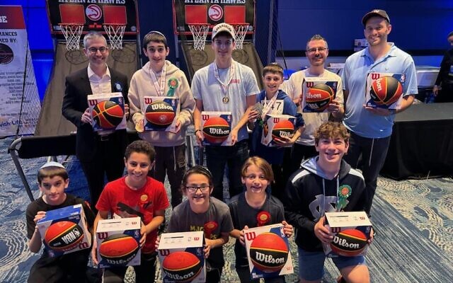The top 12 scorers in the Hoop Shoot Contest won Atlanta Hawks basketballs autographed by team mascot Harry the Hawk.