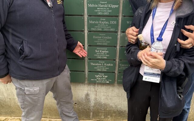 (From left) Alon Wald joins Barbara and Alan Kaplan at the Wall of Honor in front of the plaque dedicated to the Kaplans’ fathers, Homer Gordon and Marvin Kaplan.