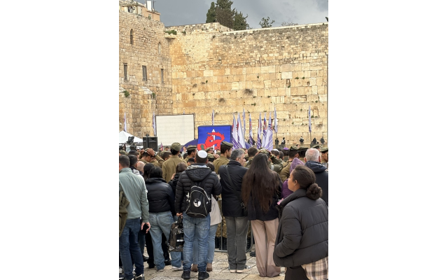 Soldiers are being inducted during a ceremony at the Western Wall.