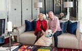 Lori and Ken Cohen relax with white retriever Lightning // Photos by Howard Mendel