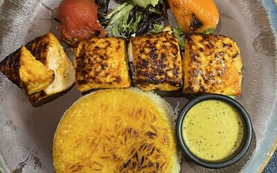 The Chargrilled Chilean Sea bass is seasoned with citrus and saffron and choice of polo.