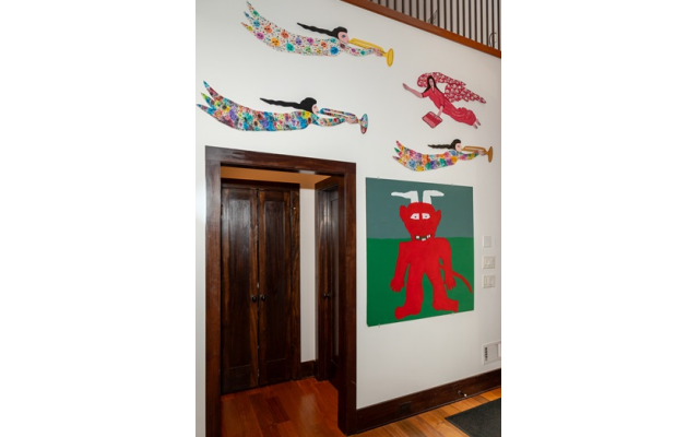 Below: Famous folk artist/preacher Howard Finster created these angels hovering over “Red Devil,” by Jake McCord.