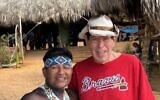 Bruce posed with the Embera chief in the Panamanian rain forest.