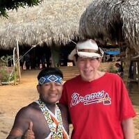 Bruce posed with the Embera chief in the Panamanian rain forest.