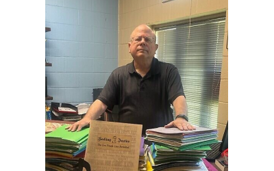 Rabbi Steve Lebow at his desk with some of the Leo Frank materials he has amassed over the years.