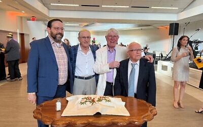 Rabbi Jonathon Adler, Bob Bacharach, Barney Epstein, and Lou Rosengarten made the Hamotzi // Photo by Clifford Martin   