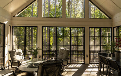 This beautiful living space was Stan Garnet’s first customer at Reynolds, Lake Oconee, featuring an open deck that was converted to a fully enclosed four seasons room. The homeowner became Builders America’s first area sales representative // Photo courtesy of Builders America