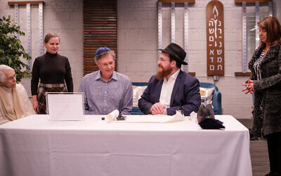 Bernie’s son, Michael Morris, pictured here wearing a blue kippah, values the sentiment in creating a communal legacy for his father.