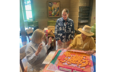 Gretchen Weir (center) loves teaching players to learn the game of mahjong.