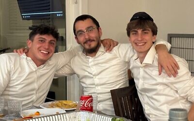 (From left) Eli Bock, Rabbi Avremel Zaltzman, Micah Kopelman