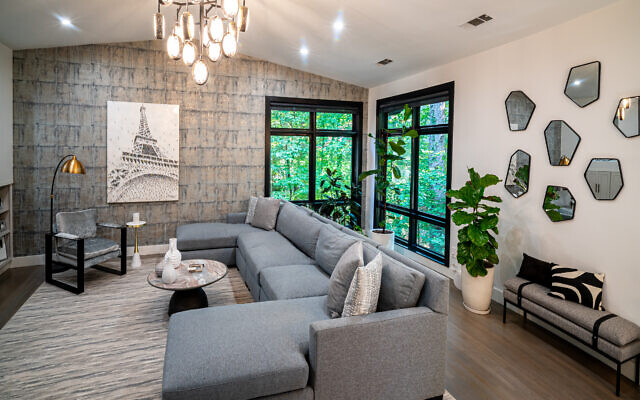 Keilin designed the living room to include a Craig Alan work depicting Paris and comfy Bernhardt couches. 