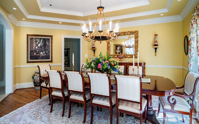 The dining room has Kindle furniture and a portrait of Alan’s mother, 97, who lives in Walterboro, S.C.