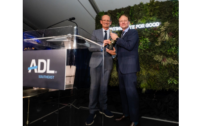 Event co-chair A.J. Robinson presents the Torch of Liberty Award to honoree Matt Bronfman.