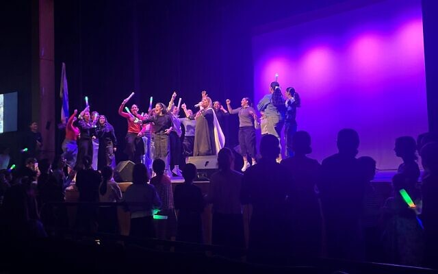 Young girls surrounded Schwartz on stage.