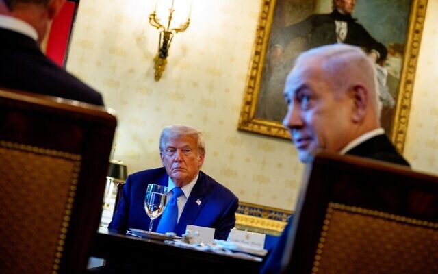 Illustrative: Prime Minister Benjamin Netanyahu answers a question, as U.S. President Donald Trump looks on, during a dinner in the Blue Room of the White House on July 7, 2025 // Photo Credit: Andrew Harnik/Getty Images via AFP/Times of Israel