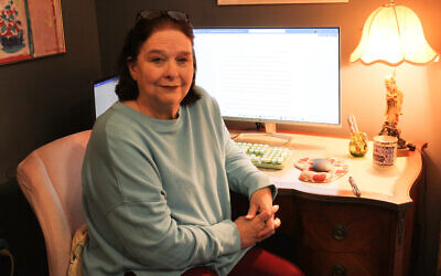 Ann Hite, author of “I Am A Georgia Girl,” seated at Lucille Selig Frank’s writing desk // Photo Credit: Ann Hite