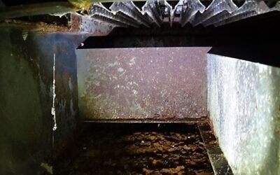 An example of a heavily rusted furnace interior and rusted heat exchanger.