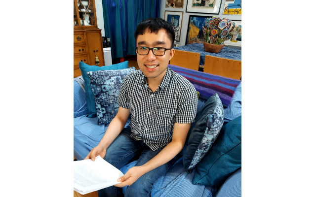 Peter Tran pictured with his Yiddish poetry. Peter Tran pictured with his Yiddish poetry.