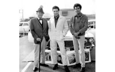 Larry Geller (right) and Colonel Tom Parker (left) eventually clashed over Geller’s influence on Elvis Presley who stands between them.